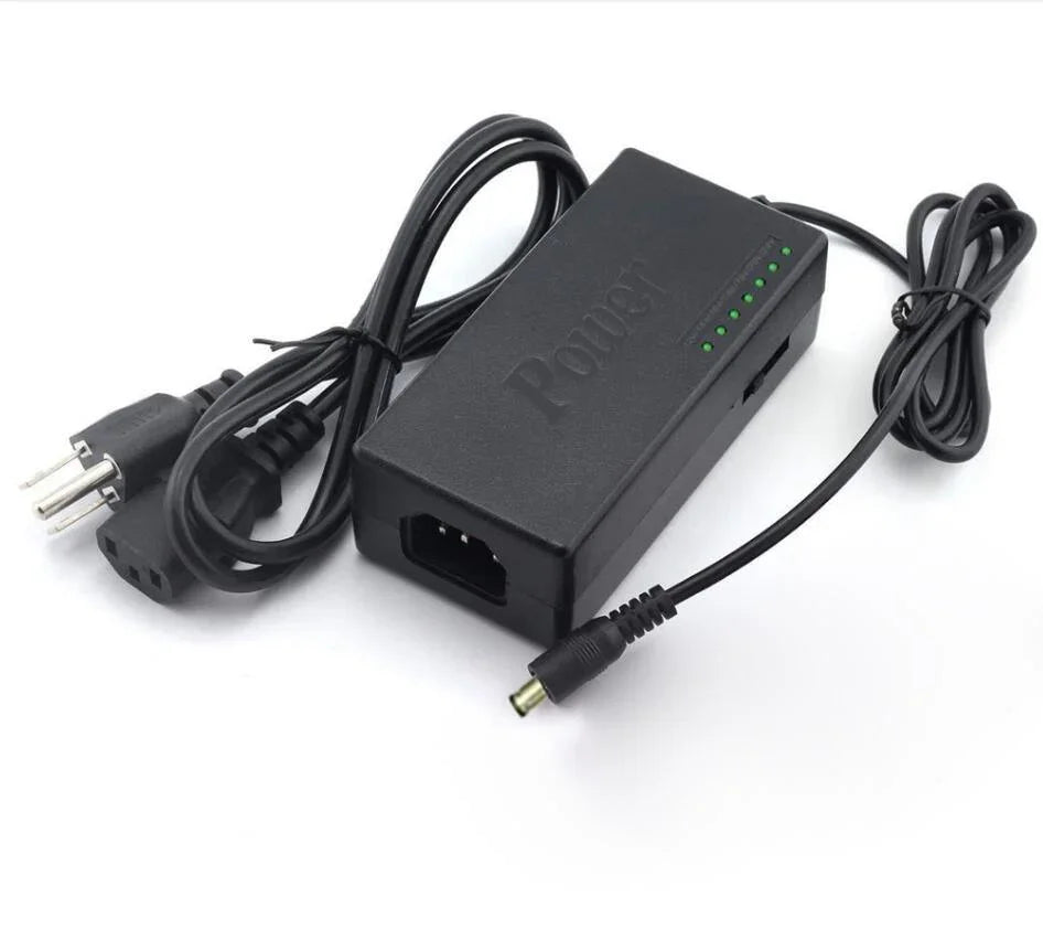 Black power adapter with green indicator lights and attached AC power cord
