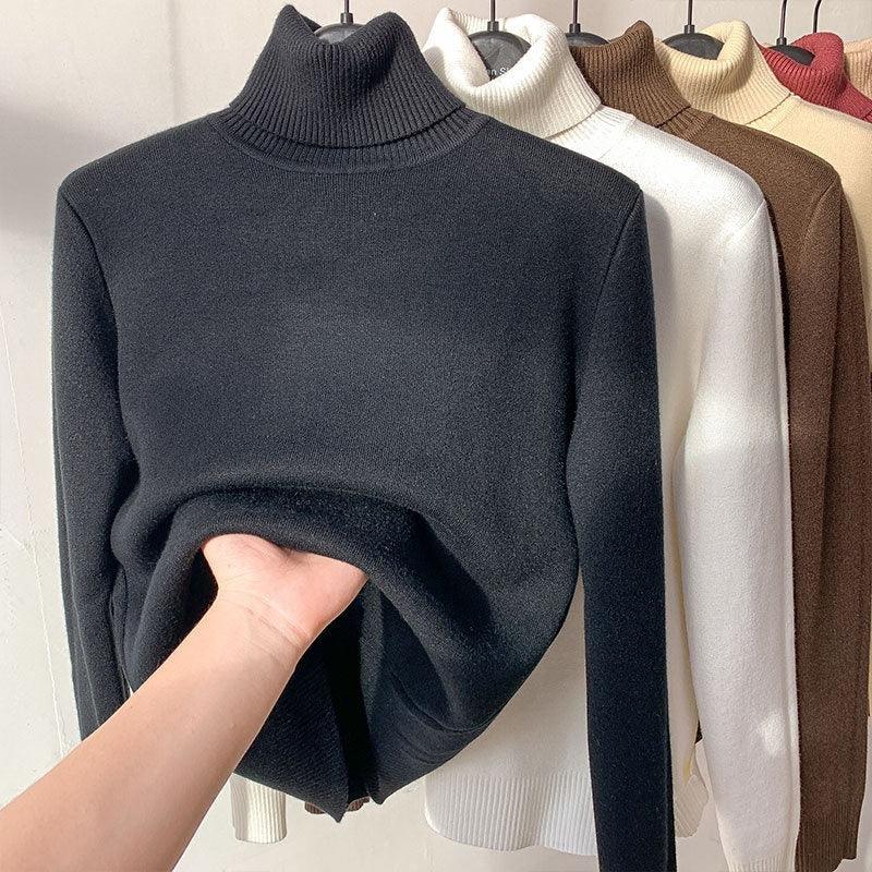 Assorted turtleneck sweaters in black, white, brown, beige, and red on hangers