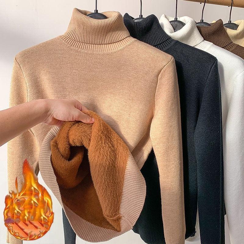 Warm fleece-lined turtleneck sweaters in beige, black, and white on hangers