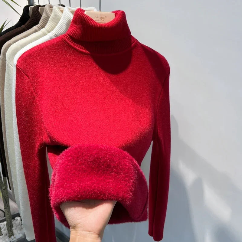Red turtleneck sweater with soft plush lining, winter knitwear on clothing rack