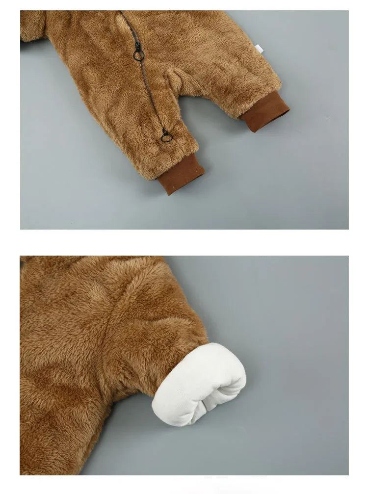 Brown fuzzy baby jumpsuit with zipper, ribbed cuffs, and mittened sleeve close-up